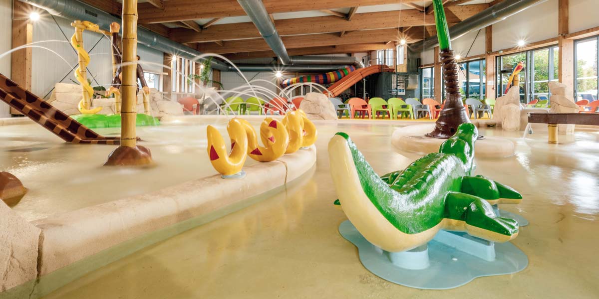 Jets of water and water toys in the swimming pool at Le Fief campsite