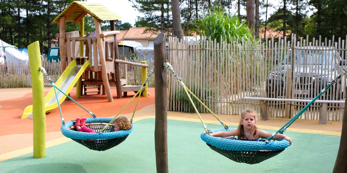 Young children's area swing and slide at Le Fief campsite