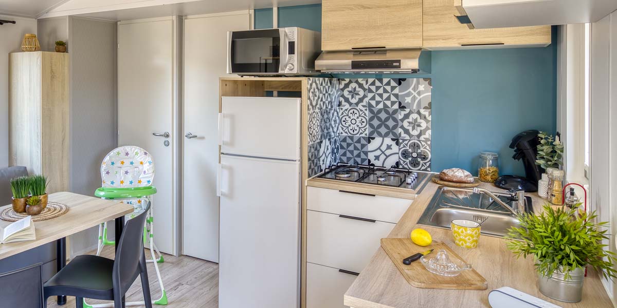 The kitchen area of the Kids mobile home at Le Fief campsite in Loire-Atlantique