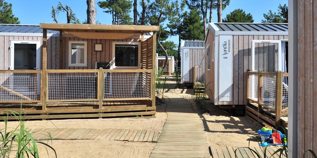 Pedestrian village of Kids mobile homes at Le Fief campsite in Loire-Atlantique