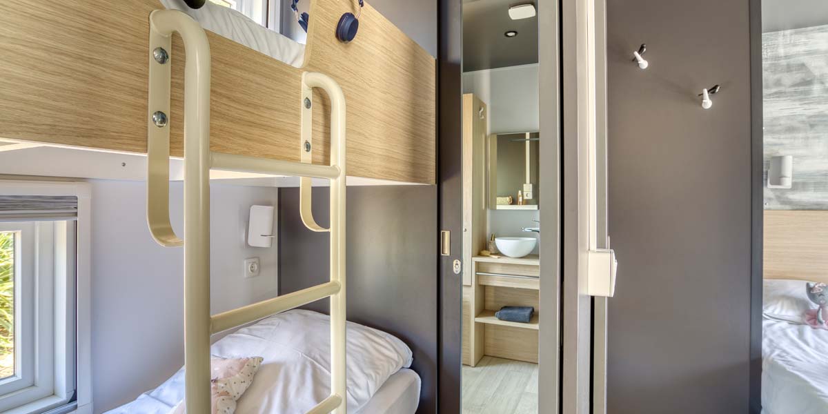 Children's room with bunk beds in the Taos 6 mobile home