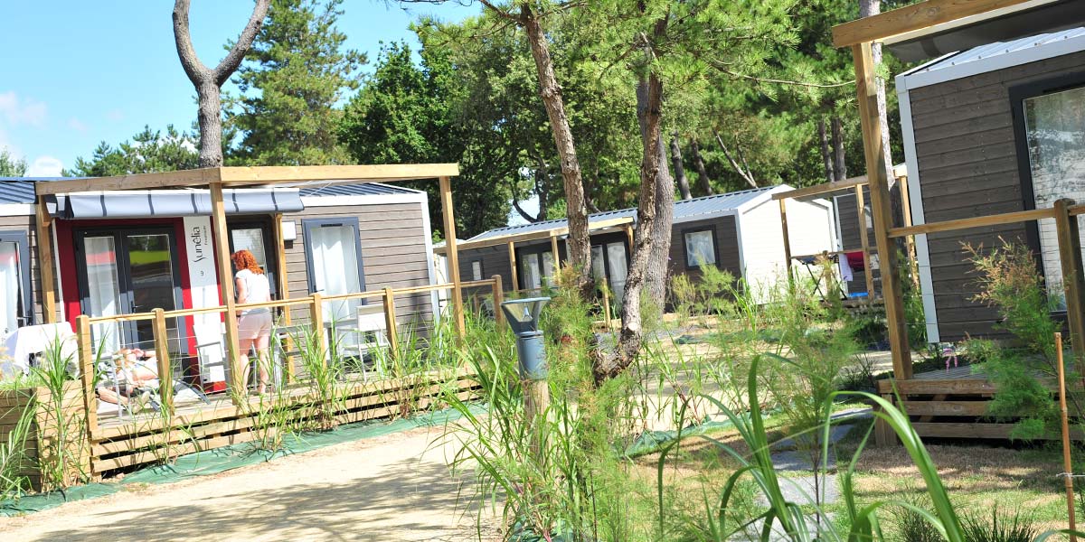 Wooded alley with mobile homes for rent in Saint-Brevin in southern Brittany