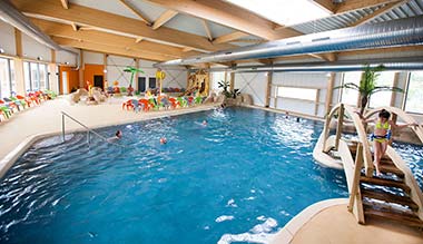 View of the indoor swimming pool area at Le Fief campsite Brittany